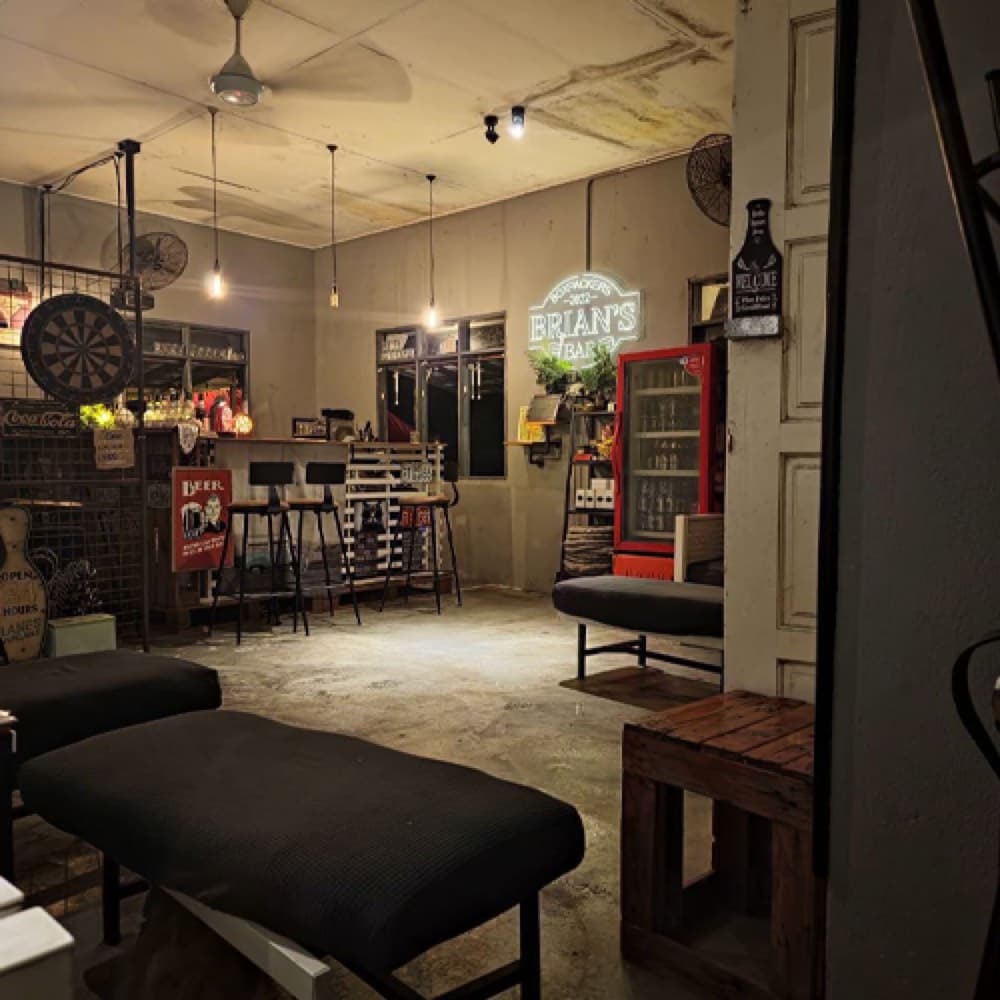 Inside the bar — concrete floor and warm lamplight